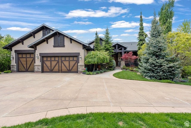 1562 E Granite Brook Ct S, Draper, UT 84020 - view of front of property with stone siding, stucco siding, concrete driveway, and an attached garage