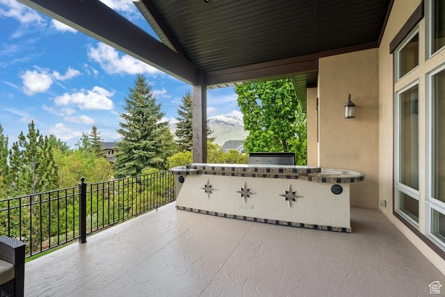 1562 E Granite Brook Ct S, Draper, UT 84020 - view of patio featuring exterior kitchen and a balcony