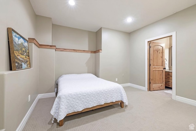 carpeted bedroom featuring baseboards, connected bathroom, and recessed lighting