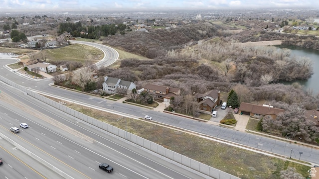 birds eye view of property featuring a water view and a residential view