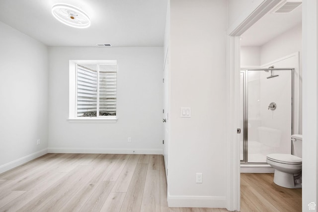 538 N 550 W, Smithfield, UT 84335 - full bathroom with a stall shower, toilet, wood finished floors, baseboards, and visible vents