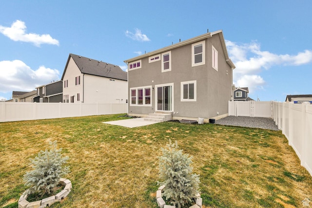 538 N 550 W, Smithfield, UT 84335 - rear view of house featuring a fenced backyard, entry steps, a yard, and a patio area