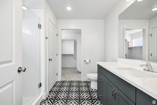 538 N 550 W, Smithfield, UT 84335 - bathroom featuring baseboards, toilet, recessed lighting, vanity, and a stall shower
