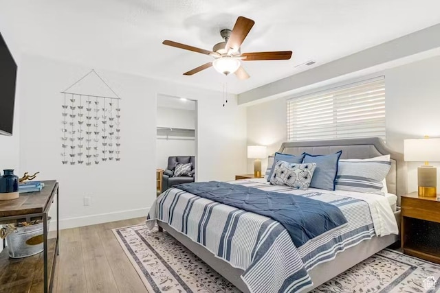 2233 S Beachcomber Ln, Garden City, UT 84028 - bedroom featuring a closet, a ceiling fan, baseboards, visible vents, and light wood-style floors