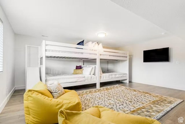 2233 S Beachcomber Ln, Garden City, UT 84028 - bedroom featuring baseboards and wood finished floors