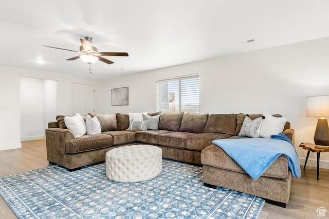 2233 S Beachcomber Ln, Garden City, UT 84028 - living room with a ceiling fan, baseboards, and light wood-style floors