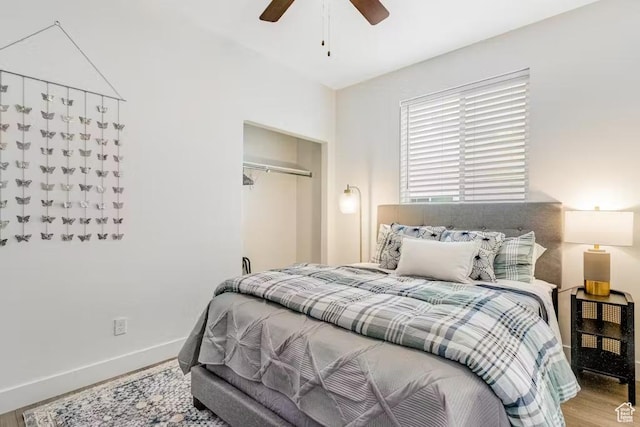2233 S Beachcomber Ln, Garden City, UT 84028 - bedroom with baseboards, ceiling fan, wood finished floors, and a closet