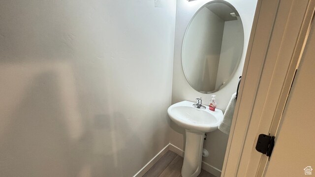 1794 N 1260 E, Payson, UT 84651 - bathroom featuring baseboards, a sink, and wood finished floors