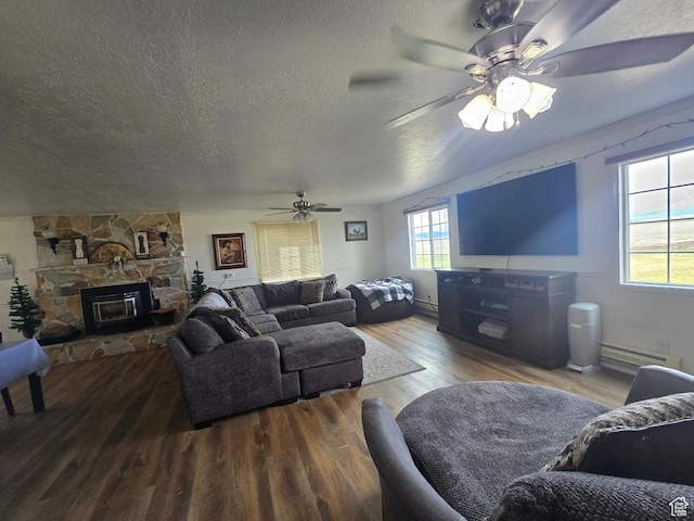 326 W 4800 S, Preston, ID 83263 - living area with a fireplace, a textured ceiling, wood finished floors, and a ceiling fan