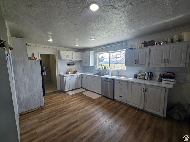 326 W 4800 S, Preston, ID 83263 - kitchen featuring light countertops, dishwasher, dark wood finished floors, and a sink