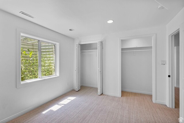5025 N Shady Bend Ln, Lehi, UT 84043 - unfurnished bedroom with two closets, light colored carpet, recessed lighting, and baseboards