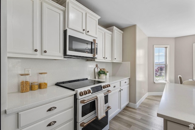 5025 N Shady Bend Ln, Lehi, UT 84043 - kitchen featuring white appliances, light countertops, white cabinets, and light wood finished floors