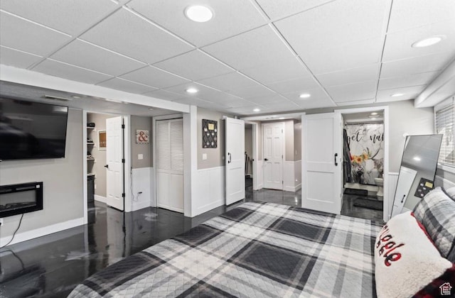bedroom featuring a spacious closet, a closet, and recessed lighting