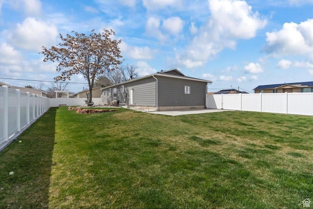 view of yard with a fenced backyard and a patio