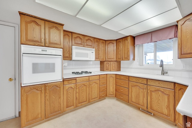 6102 W 13400 S, Herriman, UT 84096 - kitchen with white appliances, tasteful backsplash, light countertops, and a sink