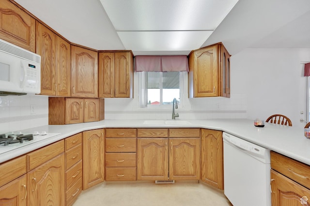 6102 W 13400 S, Herriman, UT 84096 - kitchen featuring light countertops, visible vents, white appliances, a sink, and brown cabinetry