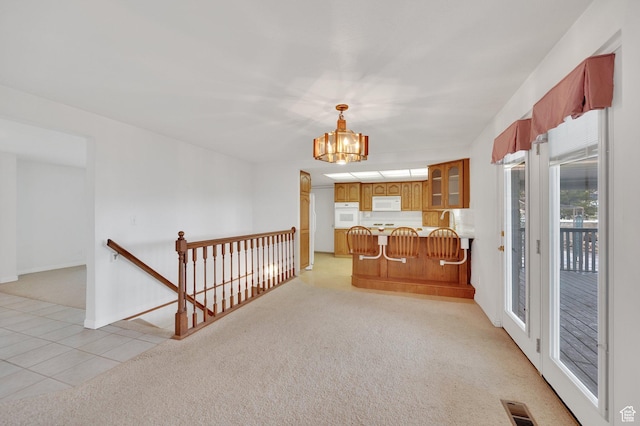 6102 W 13400 S, Herriman, UT 84096 - interior space with white appliances, a peninsula, and light carpet