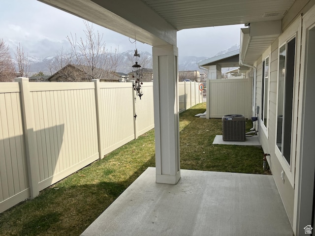 285 W 1580 N Unit 102, Logan, UT 84341 - view of yard featuring central AC unit, a fenced backyard, and a patio area