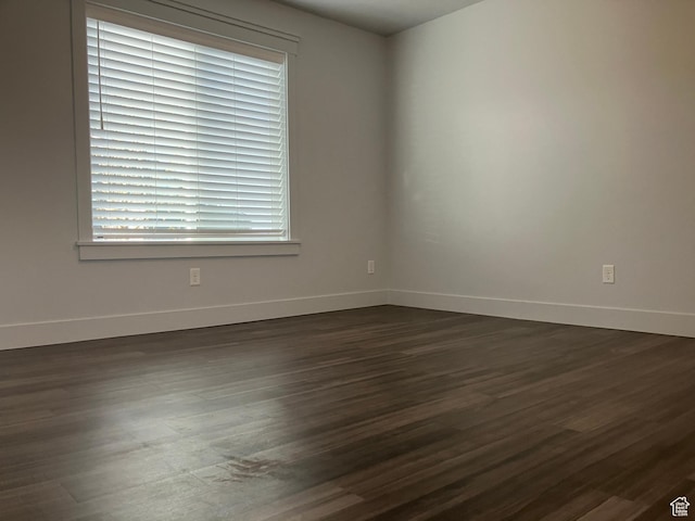 285 W 1580 N Unit 102, Logan, UT 84341 - unfurnished room with baseboards and dark wood-style flooring