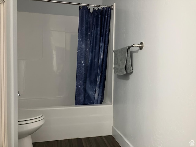 285 W 1580 N Unit 102, Logan, UT 84341 - bathroom with baseboards, wood finished floors, shower / bath combination with curtain, and toilet