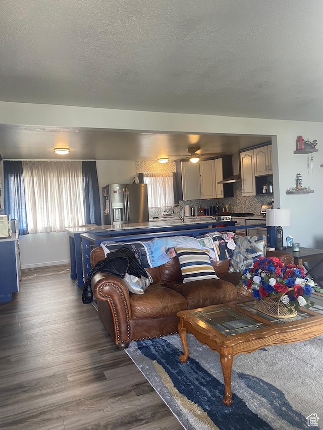 6489 W Castle View Dr S, West Valley City, UT 84128 - living room with wood finished floors and a textured ceiling