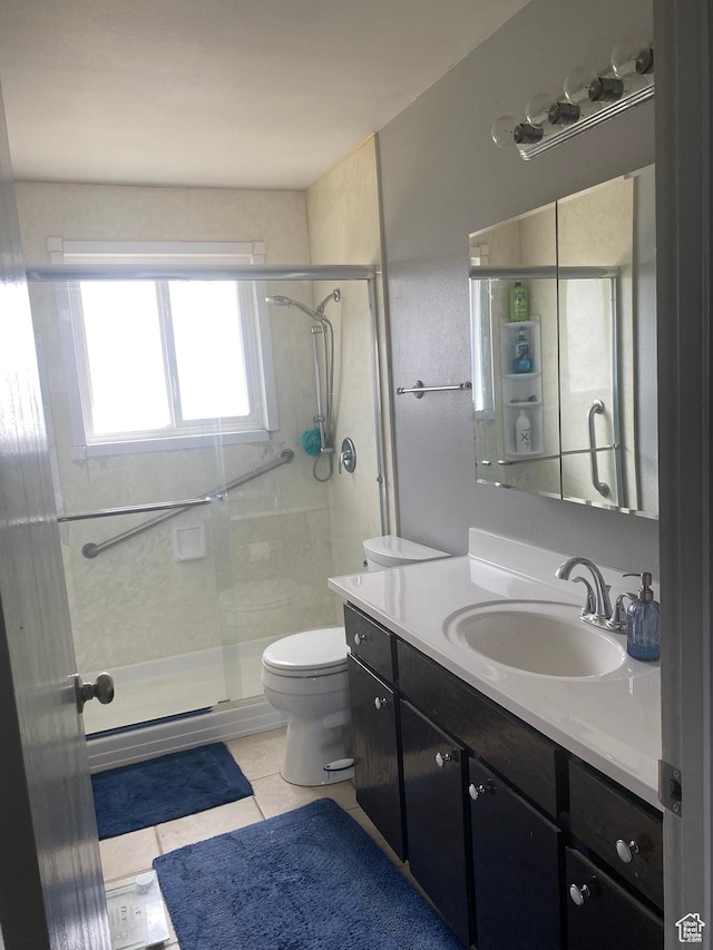 6489 W Castle View Dr S, West Valley City, UT 84128 - full bath featuring a shower stall, tile patterned floors, toilet, and vanity