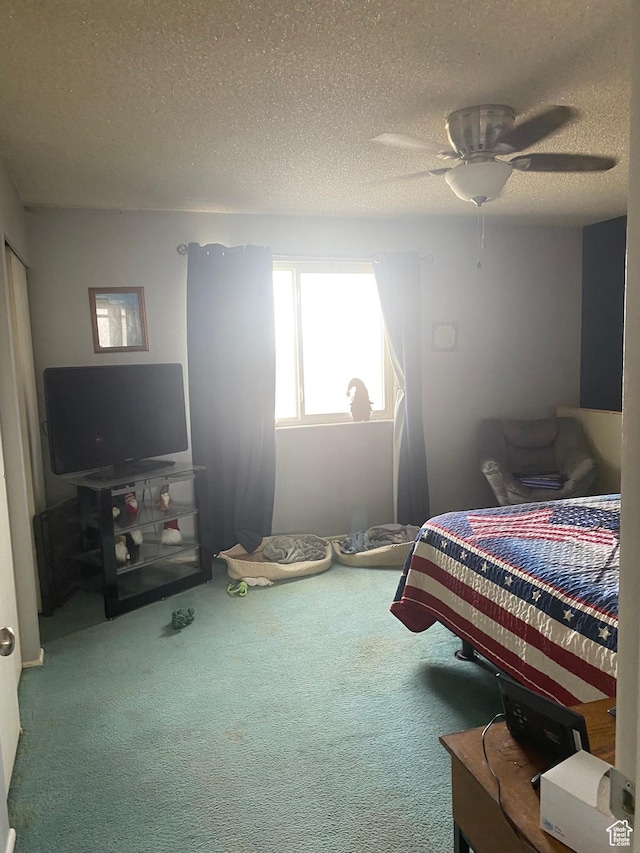 6489 W Castle View Dr S, West Valley City, UT 84128 - carpeted bedroom featuring a ceiling fan and a textured ceiling