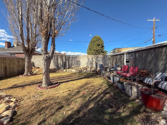 view of yard with a fenced backyard