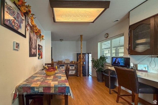 dining area with light wood finished floors