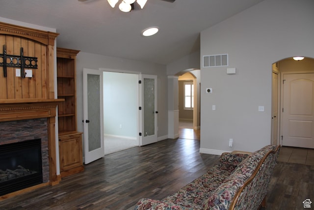 1660 N 475 E, North Ogden, UT 84404 - unfurnished living room with a stone fireplace, visible vents, arched walkways, and a ceiling fan
