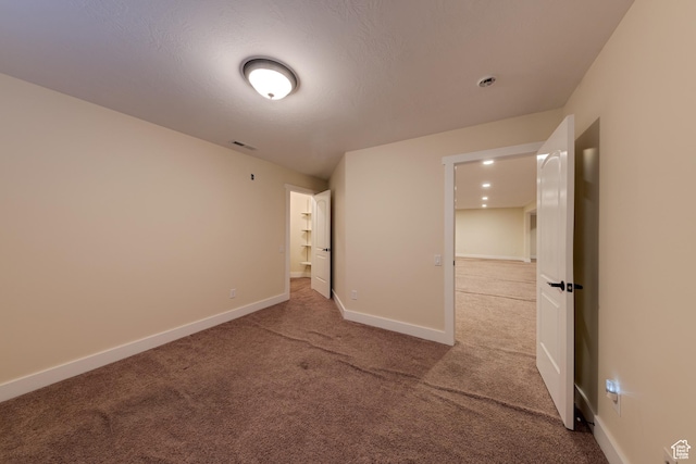 494 E Kachina Way, Moab, UT 84532 - unfurnished bedroom featuring baseboards, visible vents, and carpet