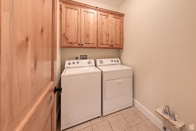 494 E Kachina Way, Moab, UT 84532 - laundry room with light tile patterned floors, cabinet space, baseboards, and washer and dryer