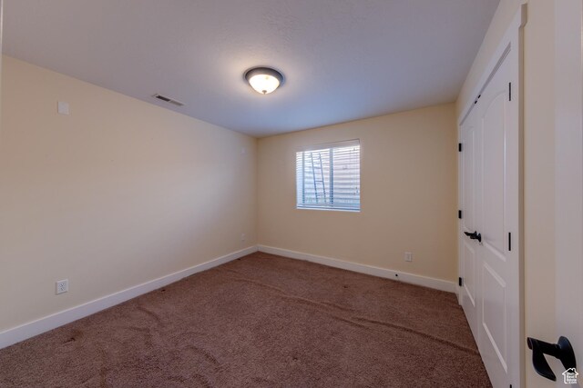 494 E Kachina Way, Moab, UT 84532 - carpeted spare room with baseboards and visible vents