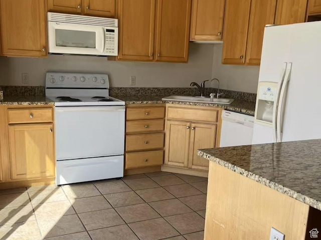 890 E Chase Brook Ln S, Millcreek, UT 84107 - kitchen featuring dark stone countertops, a sink, light tile patterned floors, and white appliances