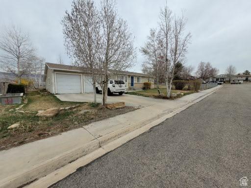 805 N Valley View Dr W, Castle Dale, UT 84513 - view of front facade featuring concrete driveway and an attached garage