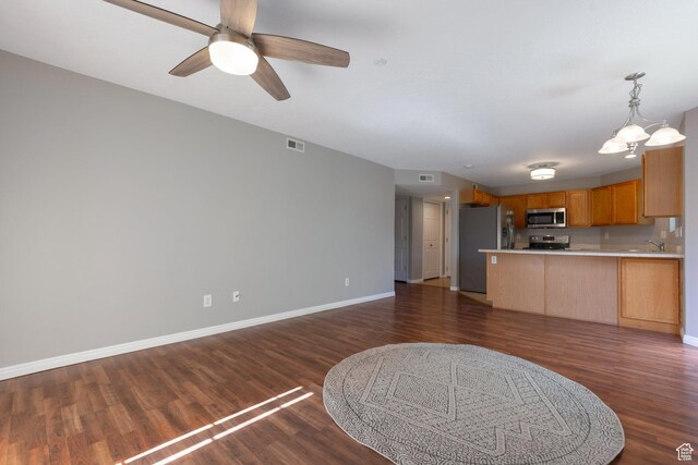 1476 W Brunello Dr S Unit C-5, Bluffdale, UT 84065 - kitchen with stainless steel appliances, open floor plan, a peninsula, and dark wood-style flooring