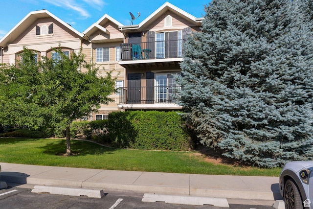 1476 W Brunello Dr S Unit C-5, Bluffdale, UT 84065 - view of front of property featuring a front yard and a balcony