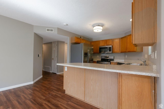 1476 W Brunello Dr S Unit C-5, Bluffdale, UT 84065 - kitchen featuring stainless steel appliances, light countertops, a peninsula, and dark wood-type flooring