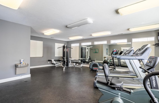 1476 W Brunello Dr S Unit C-5, Bluffdale, UT 84065 - exercise room with plenty of natural light and a textured ceiling