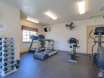3155 S Hidden Valley Dr Unit 331, St George, UT 84790 - exercise area with baseboards, visible vents, and a textured ceiling