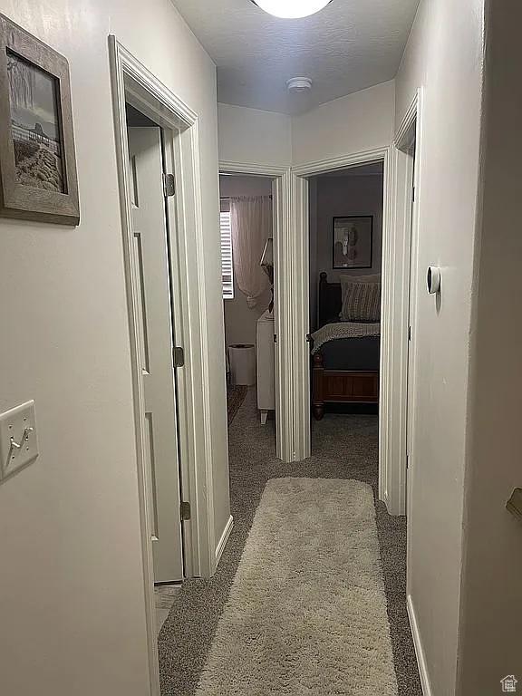 3155 S Hidden Valley Dr Unit 331, St George, UT 84790 - hall with baseboards and carpet