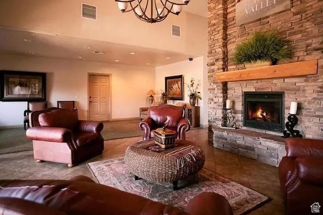 3155 S Hidden Valley Dr Unit 331, St George, UT 84790 - living room with a stone fireplace, visible vents, a towering ceiling, and a chandelier