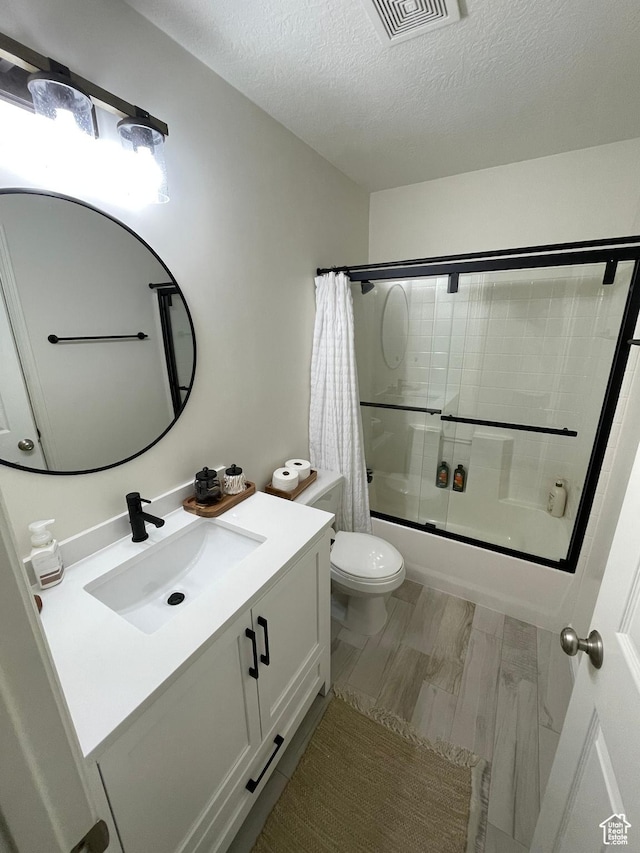 3155 S Hidden Valley Dr Unit 331, St George, UT 84790 - full bath featuring vanity, toilet, a textured ceiling, visible vents, and combined bath / shower with glass door