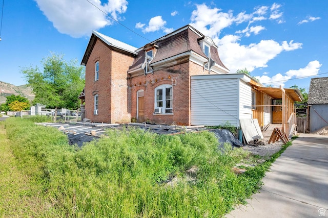 477 N 300 W, Brigham City, UT 84302 - view of side of property featuring brick siding and fence