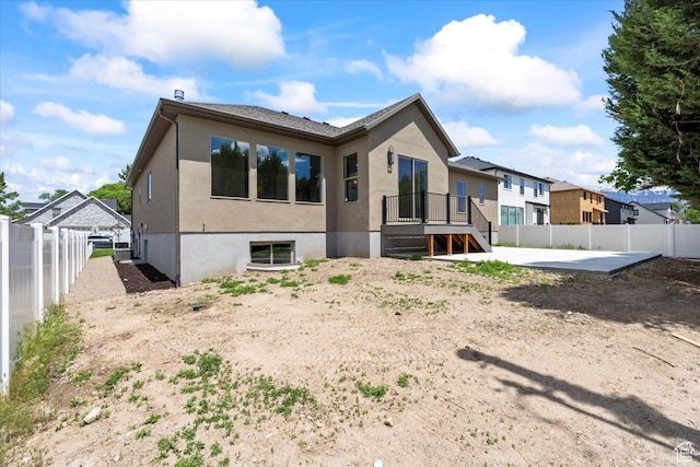 1065 W 125 S, Lehi, UT 84043 - rear view of house featuring a fenced backyard, stucco siding, and a patio area