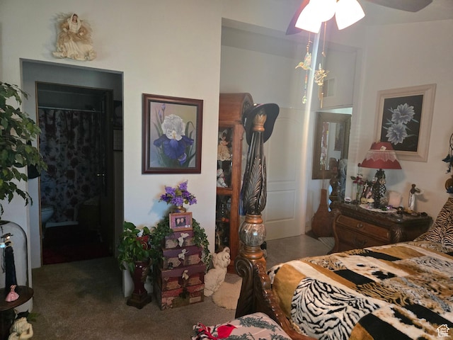 carpeted bedroom with a ceiling fan, a walk in closet, a closet, and visible vents