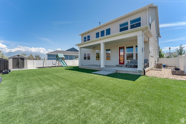 3032 W Cramden Dr, Lehi, UT 84043 - back of property with an outdoor structure, a fenced backyard, a shed, and a playground