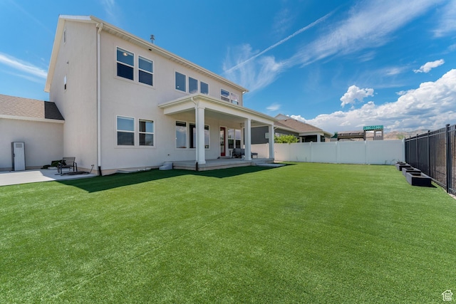 3032 W Cramden Dr, Lehi, UT 84043 - rear view of property with a fenced backyard, stucco siding, a yard, and a patio area