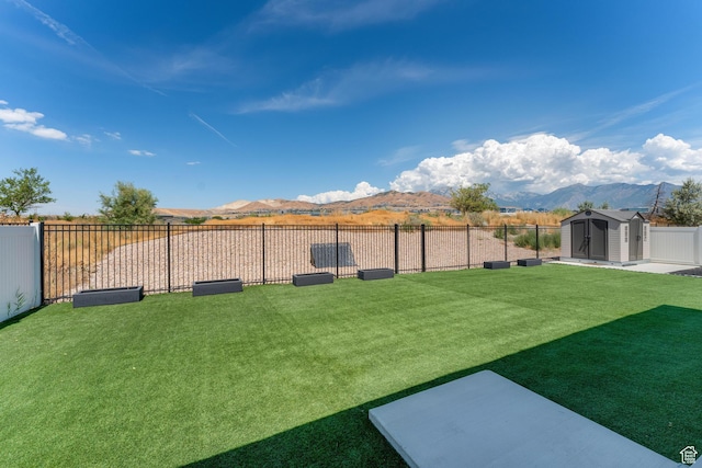 3032 W Cramden Dr, Lehi, UT 84043 - view of yard featuring a shed, an outbuilding, fence, and a mountain view
