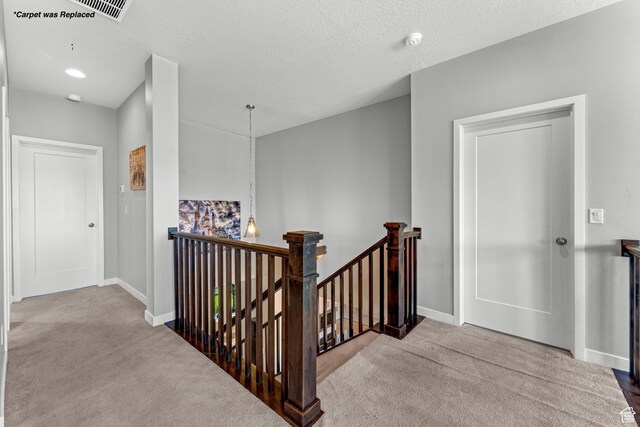 3032 W Cramden Dr, Lehi, UT 84043 - corridor with baseboards, an upstairs landing, carpet, and a textured ceiling